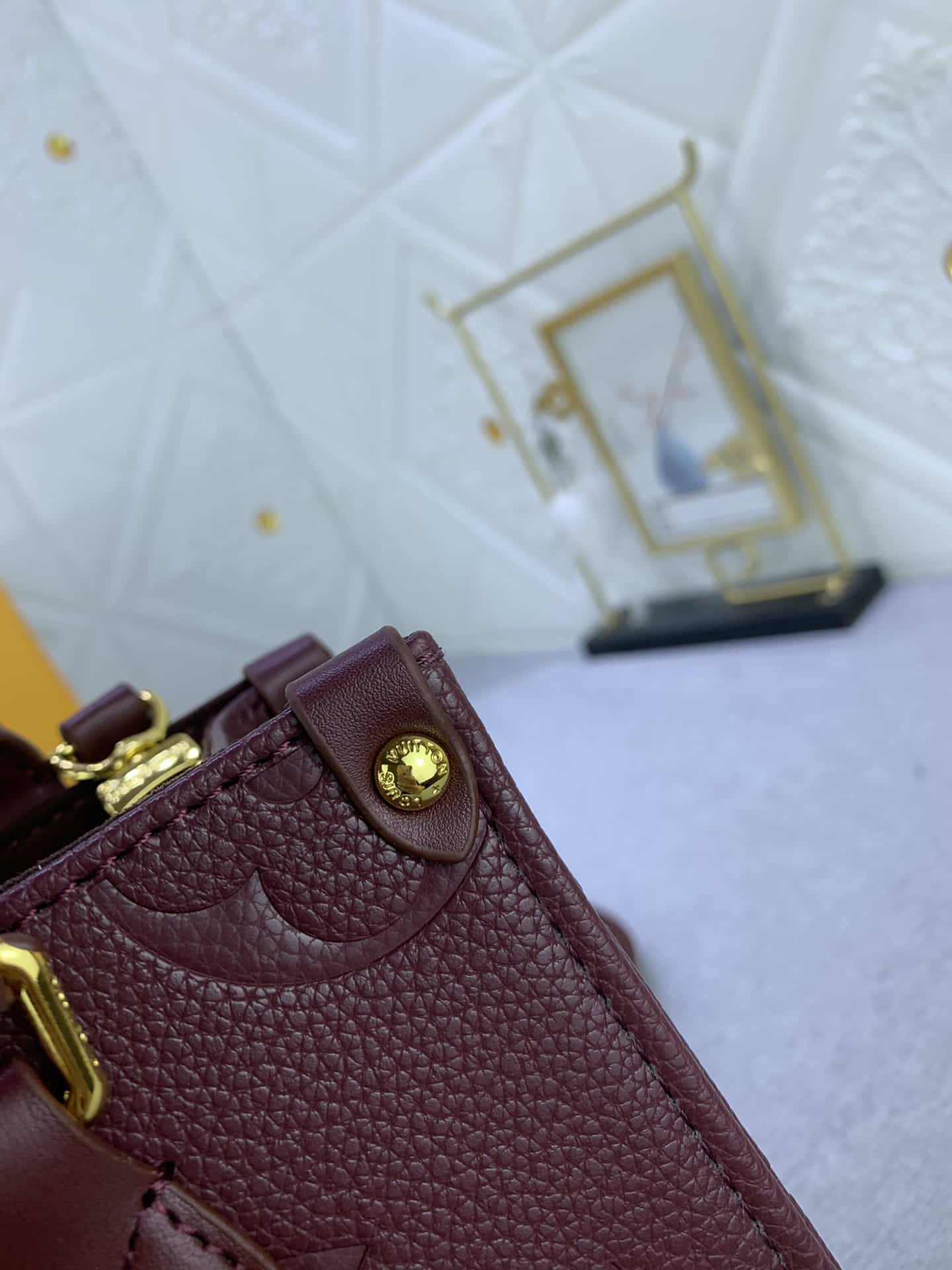 Louis Vuitton Onthego MM Monogram Empreinte Wine Red 25Cm M46601