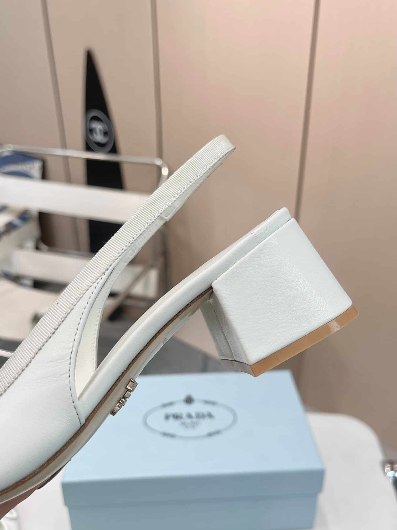 Prada Triangle Logo Bow Slingback Pump In White