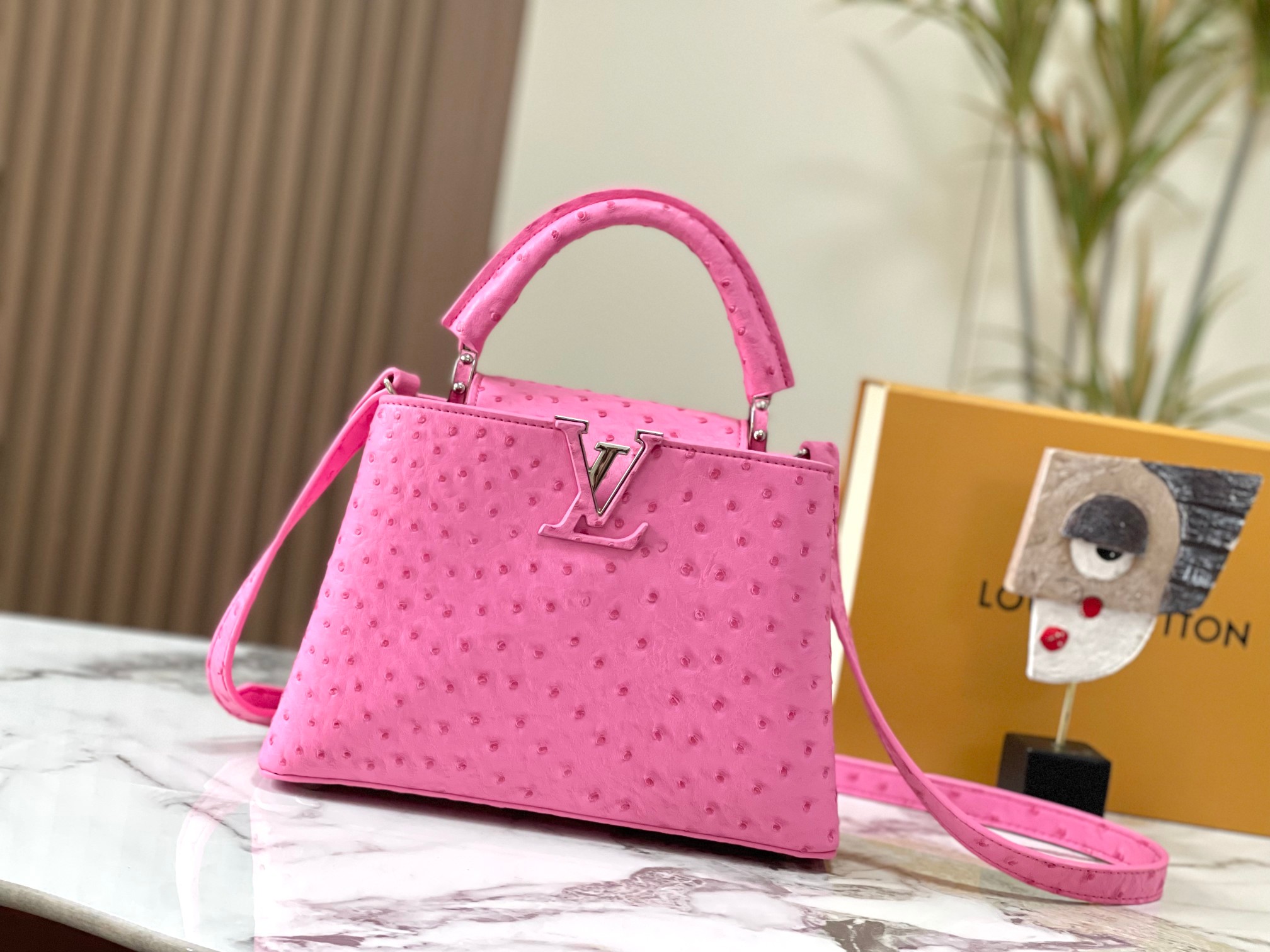 Capucines ostrich leather handbag