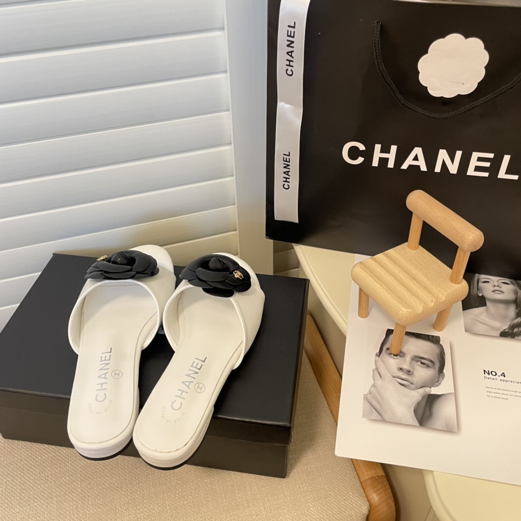 Chanel Black Camellia Slides White