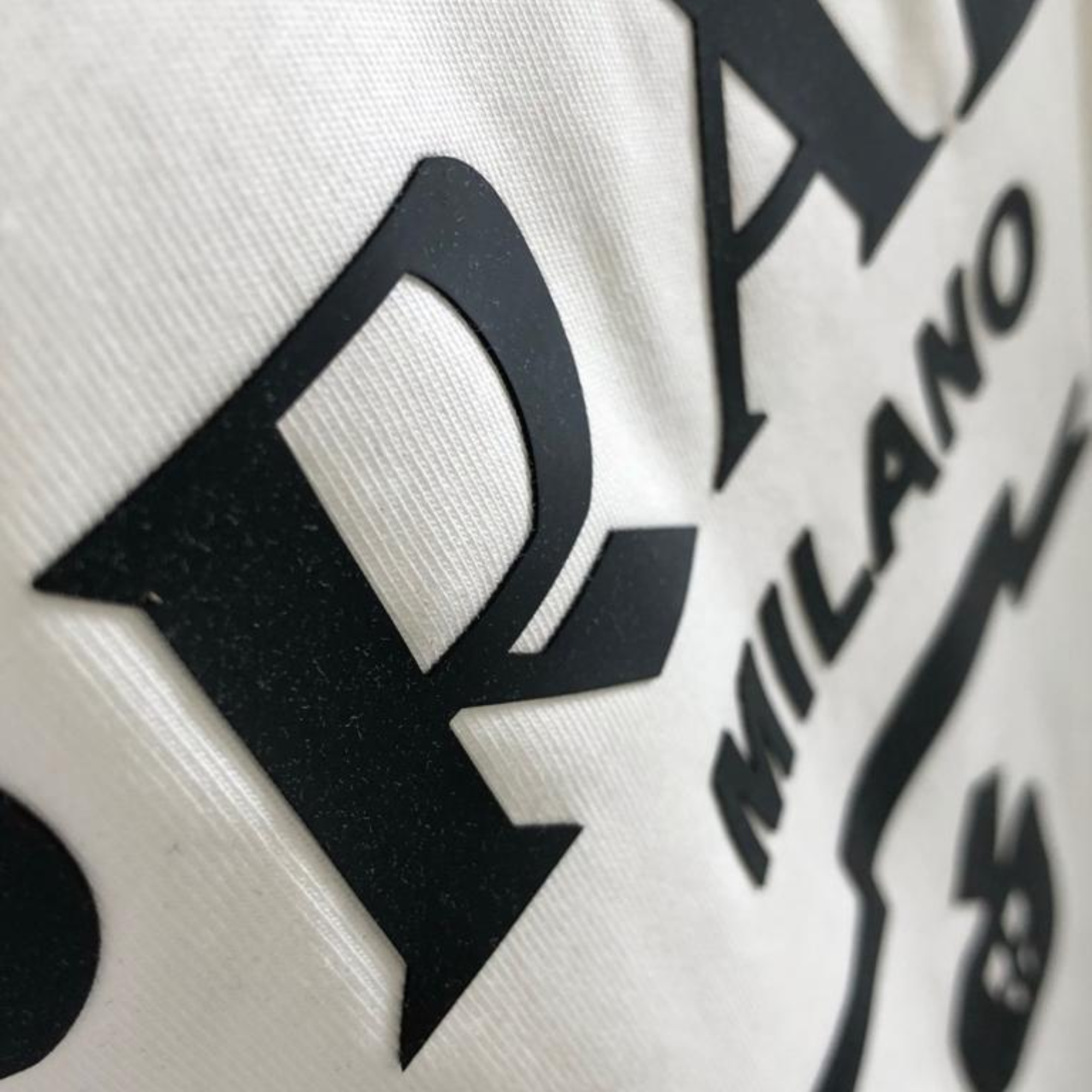 Prada Milano White Black Logo.
