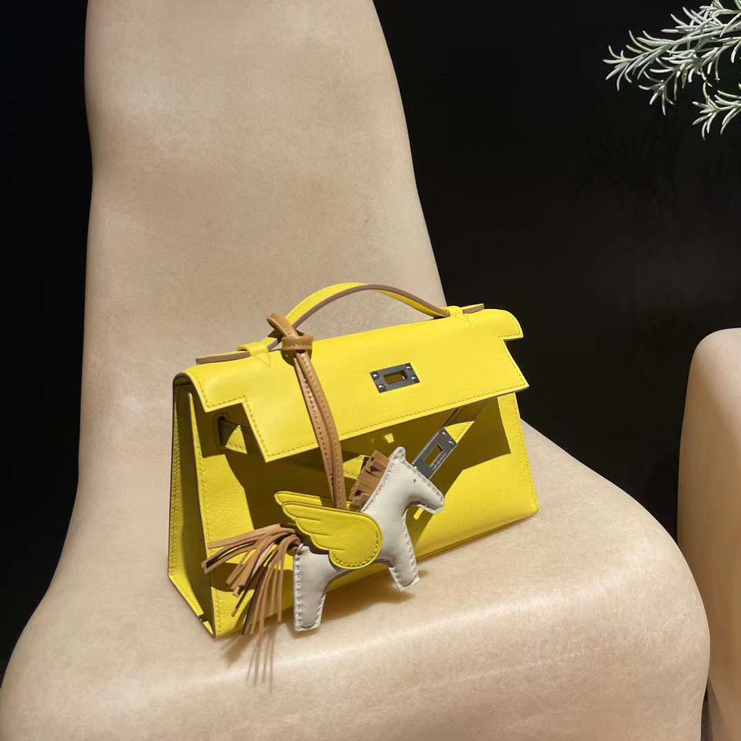 HERMES KELLY POCHETTE SWIFT皮 9R檸檬黃 銀扣 一代手拿包
