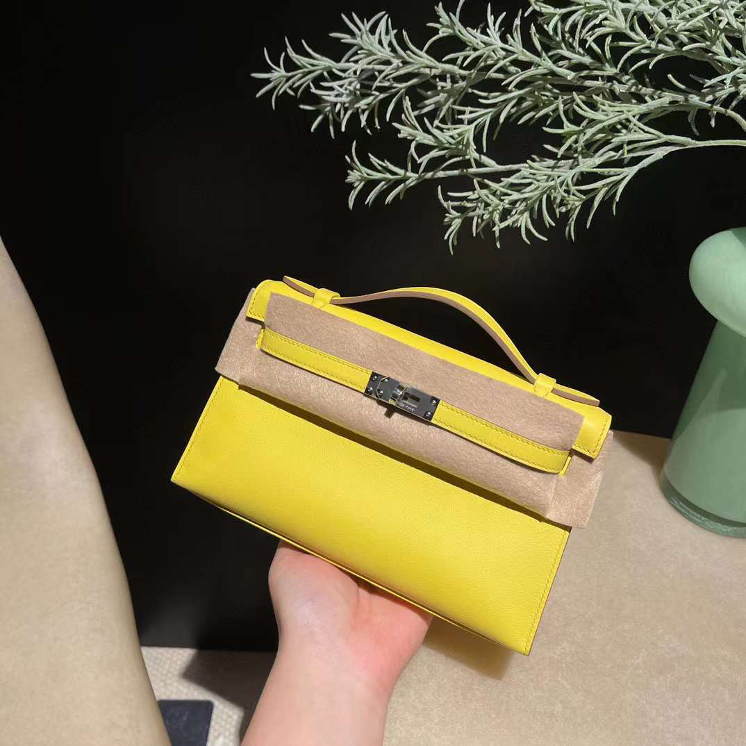 HERMES KELLY POCHETTE SWIFT皮 9R檸檬黃 銀扣 一代手拿包