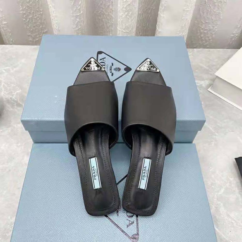 Prada Women Brushed Leather Slides with a Modernist Line Feature an Unexpected