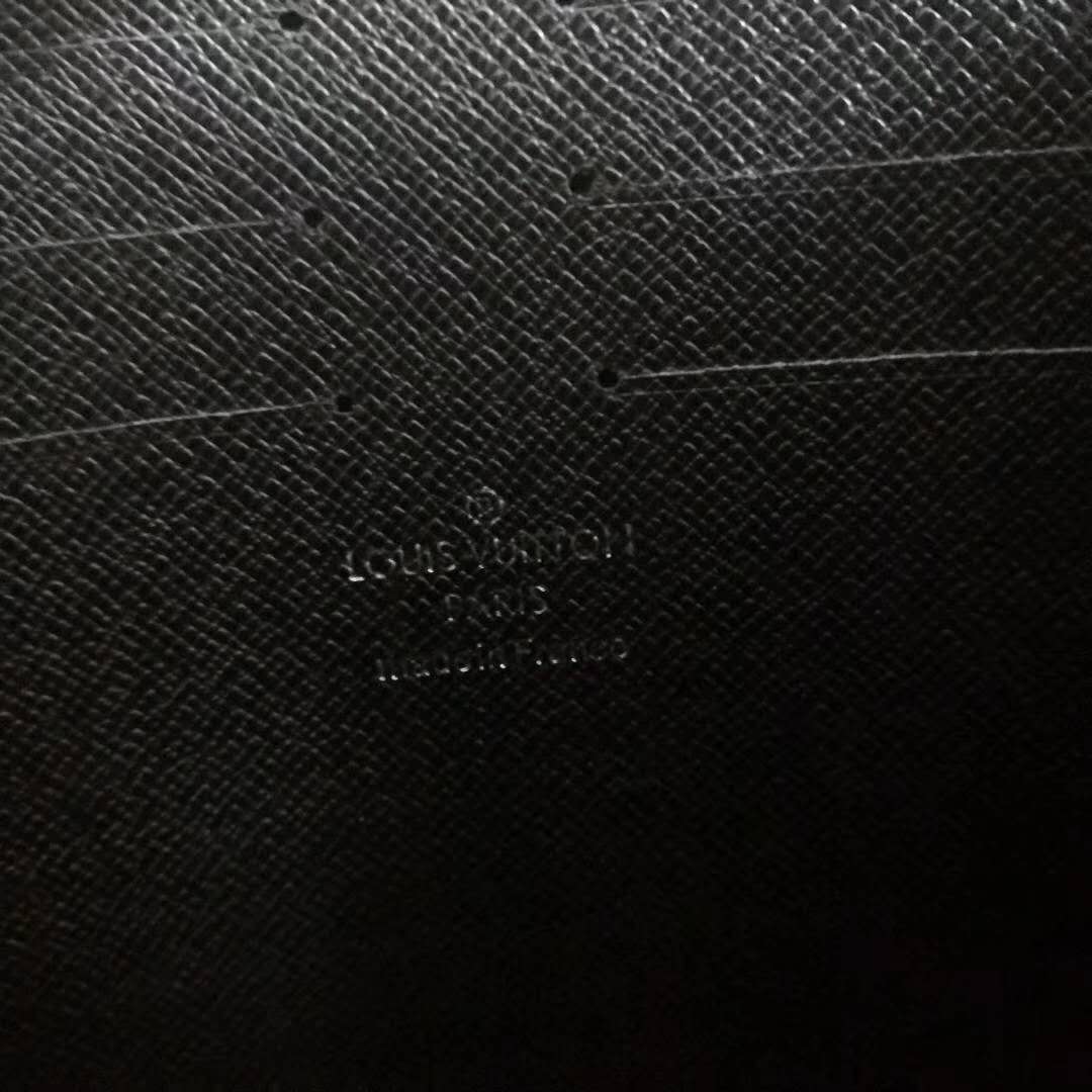 Louis Vuitton LV Men Pochette Voyage in Deep-Dyed Taiga Leather