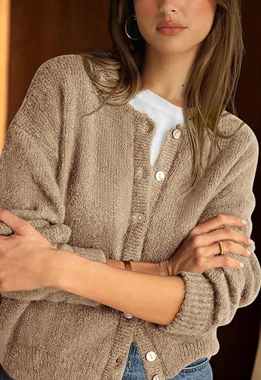 Women's long-sleeved crew neck button-up cardigan sweater, loose fit, made from thick knit fabric.
