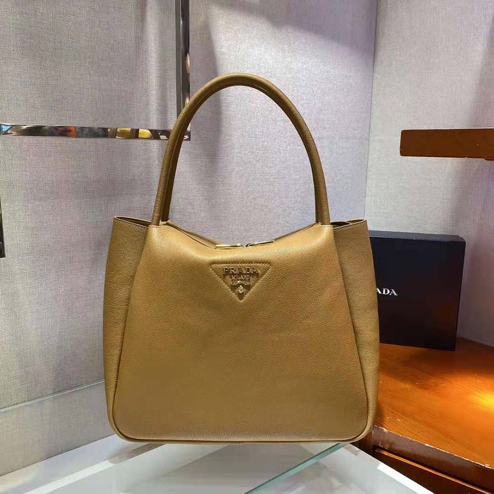 Prada Women Medium Leather Handbag with the Prada Metal Lettering Logo Illuminating Its Center-Brown