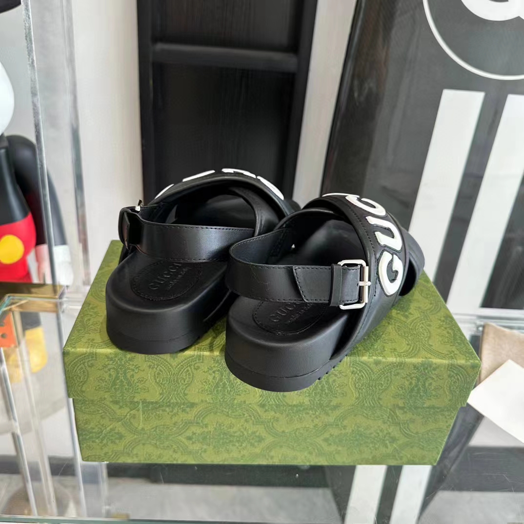 Gucci Unisex GG Gucci Sandal Smooth Black White Leather Script Rubber Buckle Flat