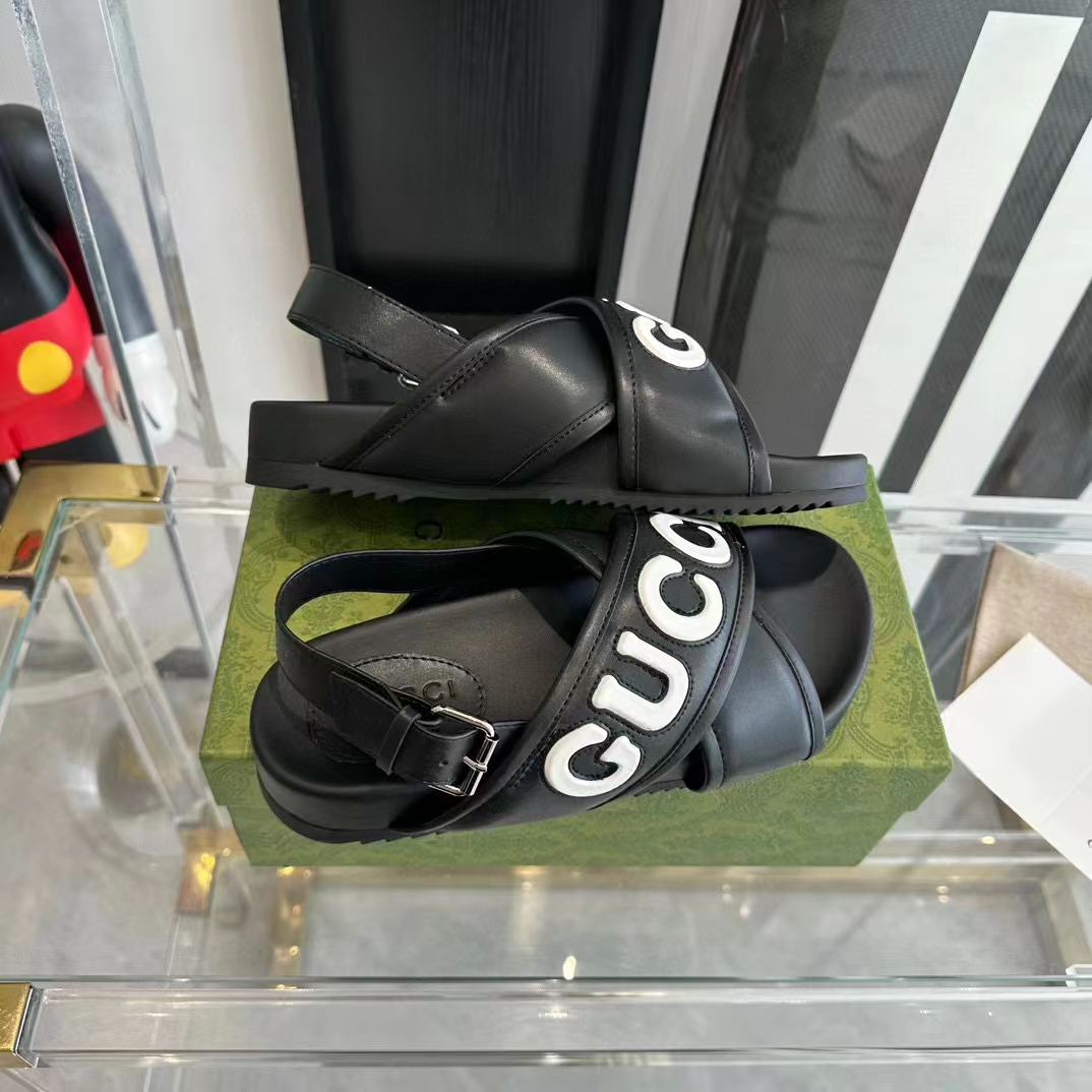 Gucci Unisex GG Gucci Sandal Smooth Black White Leather Script Rubber Buckle Flat