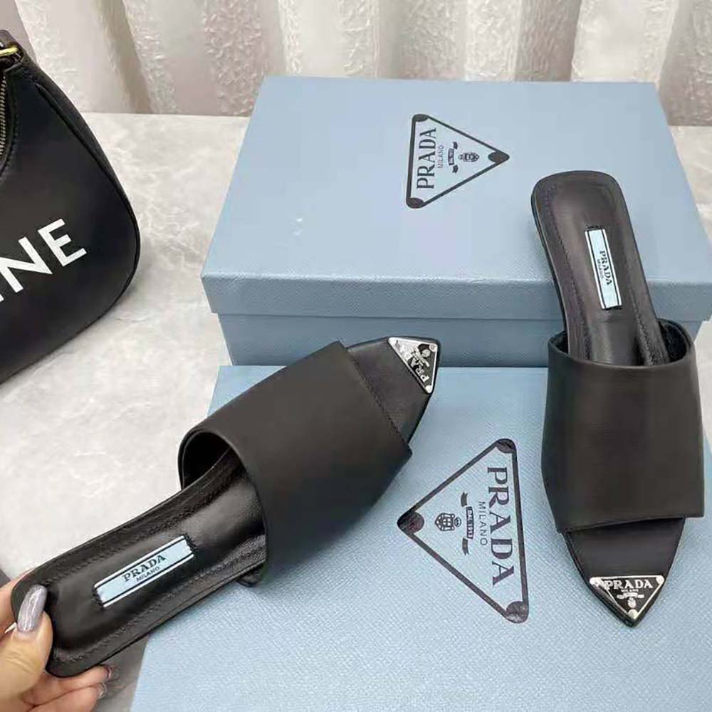 Prada Women Brushed Leather Slides with a Modernist Line Feature an Unexpected