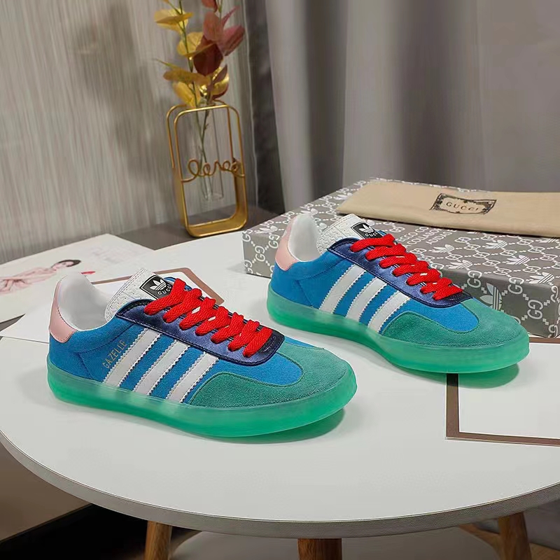 Gucci Unisex GG Adidas x Gucci Gazelle Sneaker Light Blue Silk Duchesse Demetra