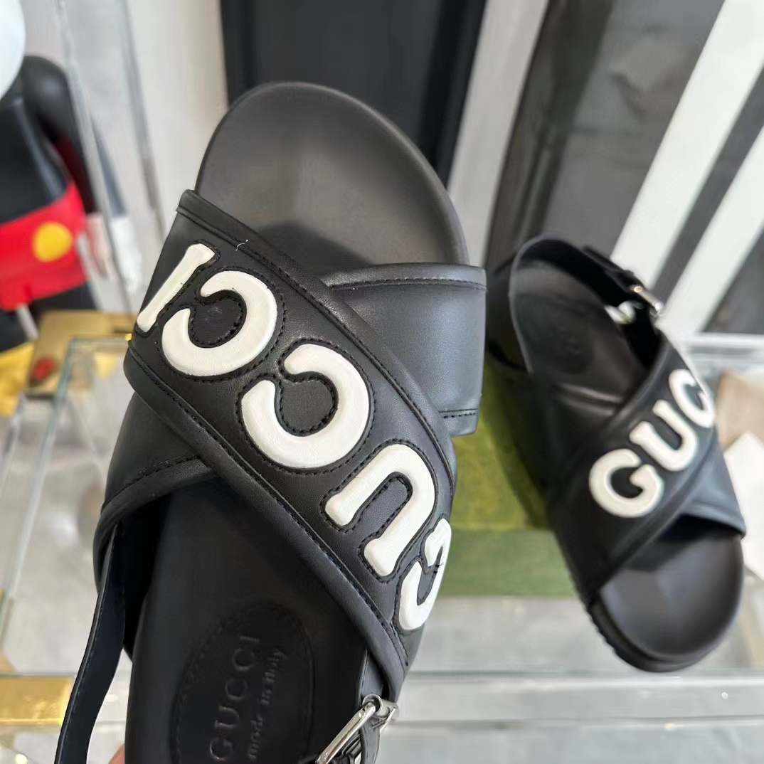 Gucci Unisex GG Gucci Sandal Smooth Black White Leather Script Rubber Buckle Flat