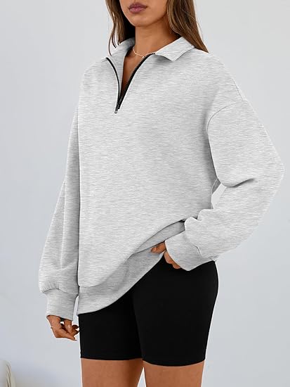 Women's Loose-fitting Half-Zip Fleece Sweatshirt - Comfortable pullover with pockets and dropped shoulders, perfect for fall and winter wear.