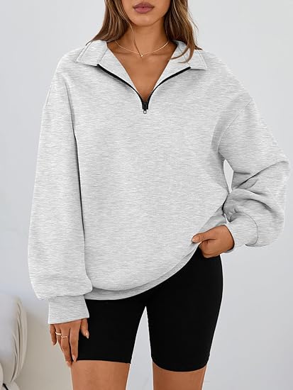 Women's Loose-fitting Half-Zip Fleece Sweatshirt - Comfortable pullover with pockets and dropped shoulders, perfect for fall and winter wear.