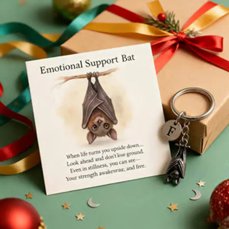 Keychain with a bat providing emotional support and a card with a message